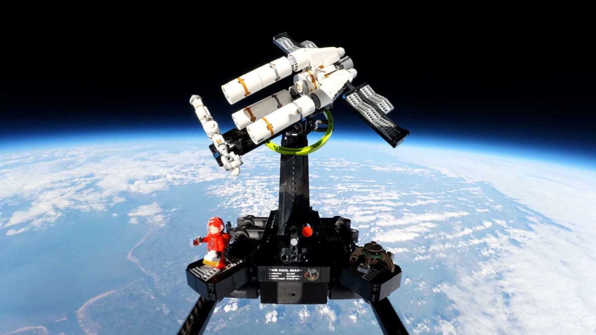 Lego Project Hail Mary spaceship suspended in stratosphere with Earth's curve visible below