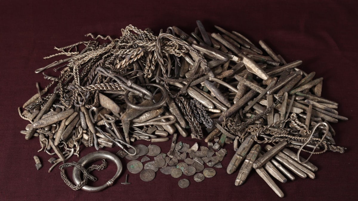 Ancient Viking silver bars, coins, jewelry and clay vessel discovered in Danish backyard