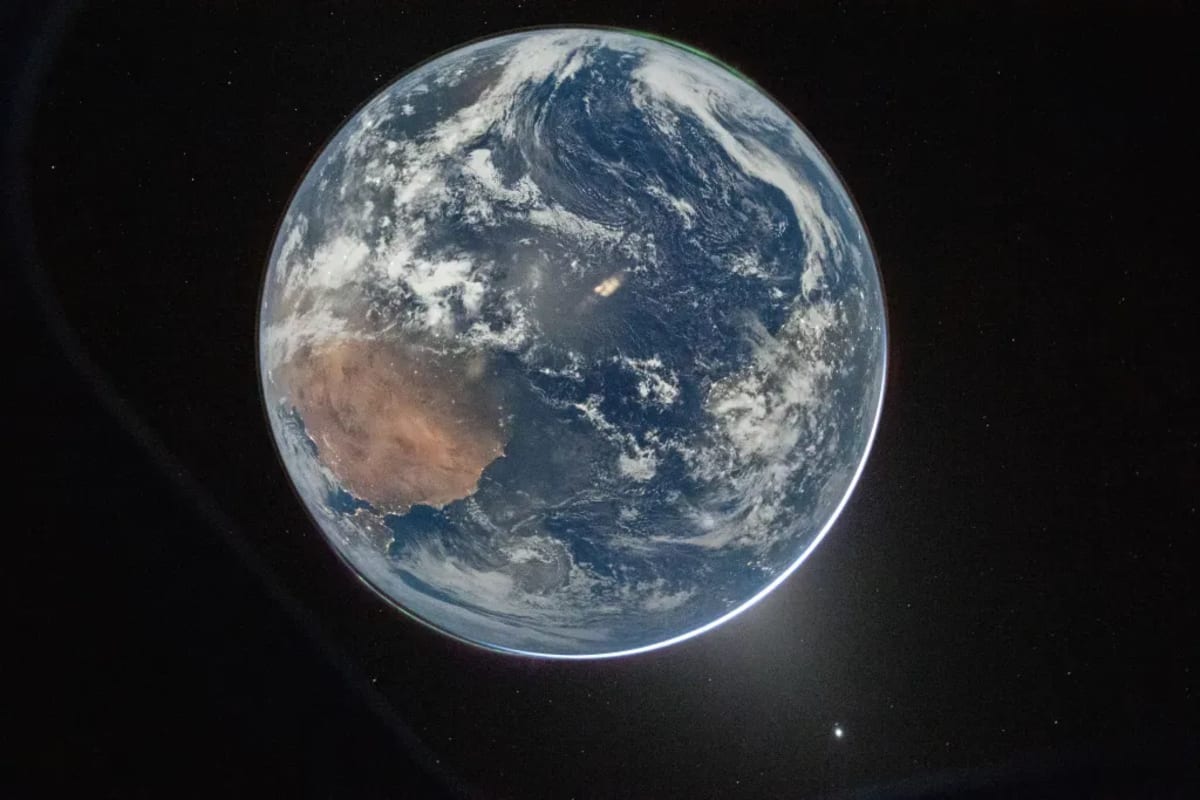 View of Earth from space captured through Orion spacecraft window during Artemis 2 lunar mission