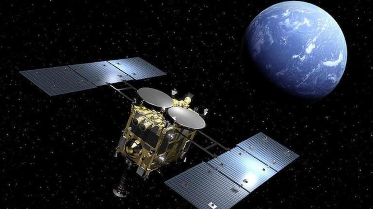Artist's illustration of Japan's Hayabusa2 spacecraft approaching an asteroid in deep space
