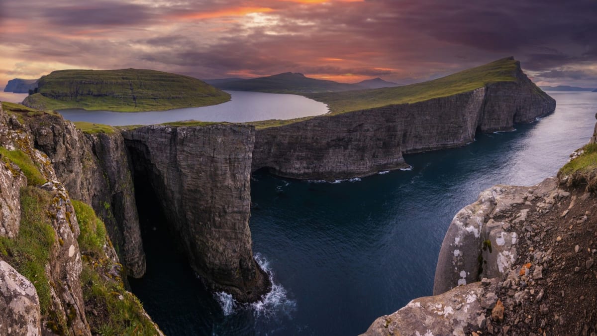 Aerial view of Sørvágsvatn lake appearing to float above the Atlantic Ocean in Faroe Islands