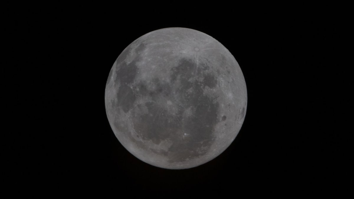 View of the moon from Artemis 2 spacecraft showing Orientale Basin on lunar disk's edge