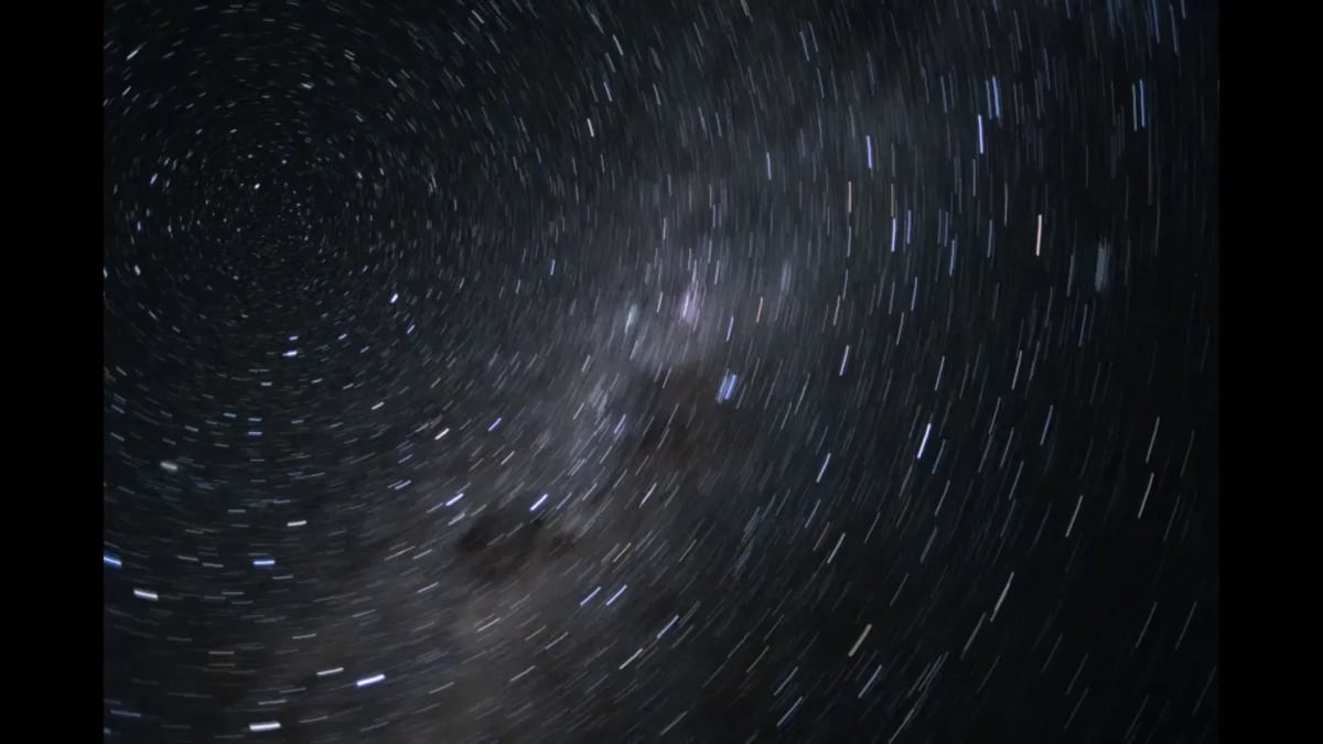 View of swirling stars through Orion capsule window during Artemis 2 moon mission