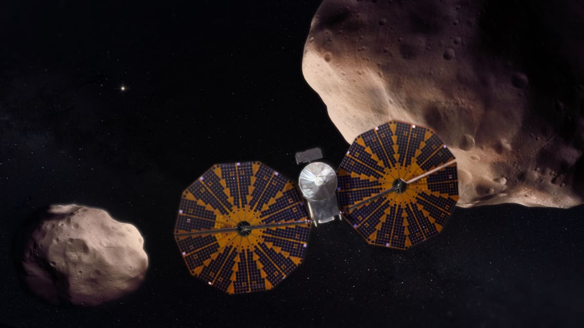 Artist rendering of NASA Lucy spacecraft flying past pair of Trojan asteroids in space