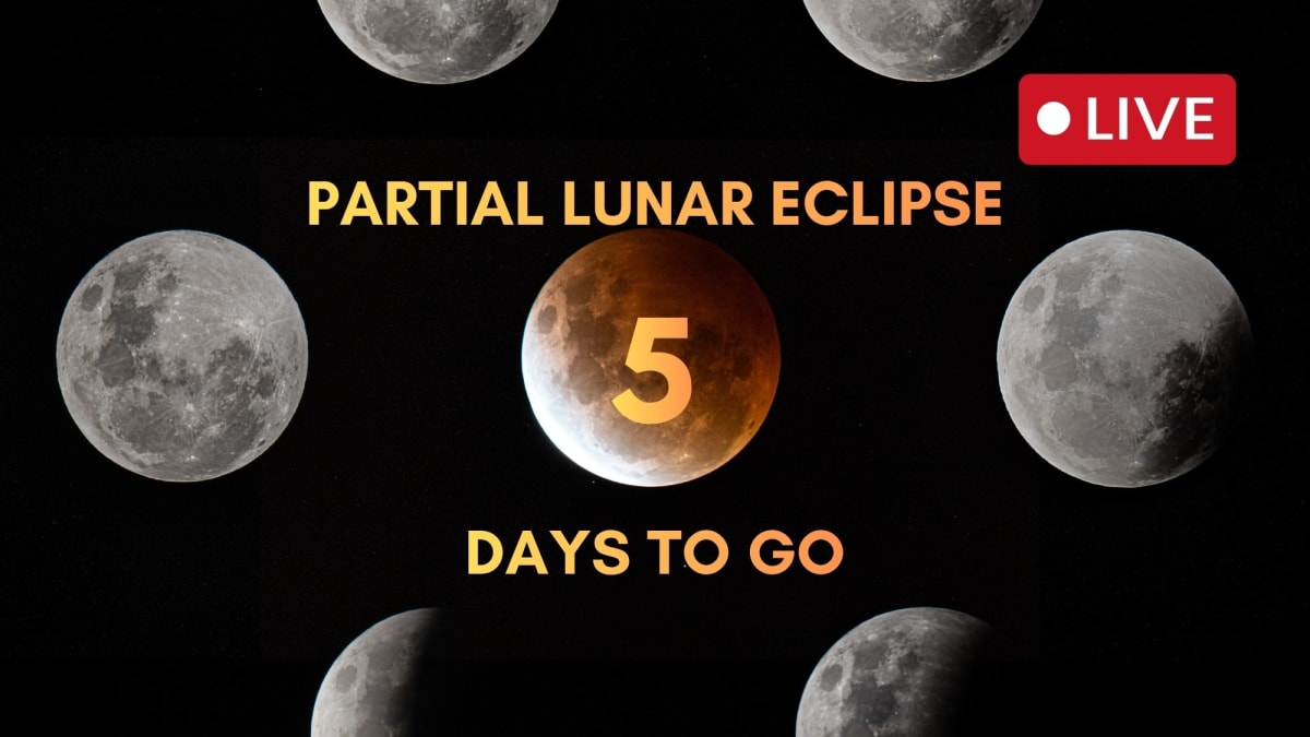 Partial lunar eclipse showing moon mostly covered in reddish shadow with bright sliver remaining illuminated
