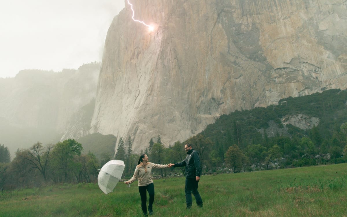 Lightning bolt strikes El Capitan cliff face during couple's rainy proposal at Yosemite National Park