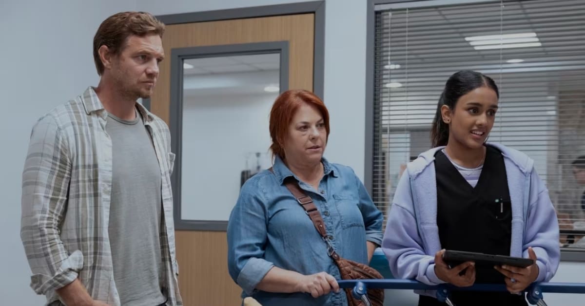 Hands holding in comfort, representing grief support and human connection during loss