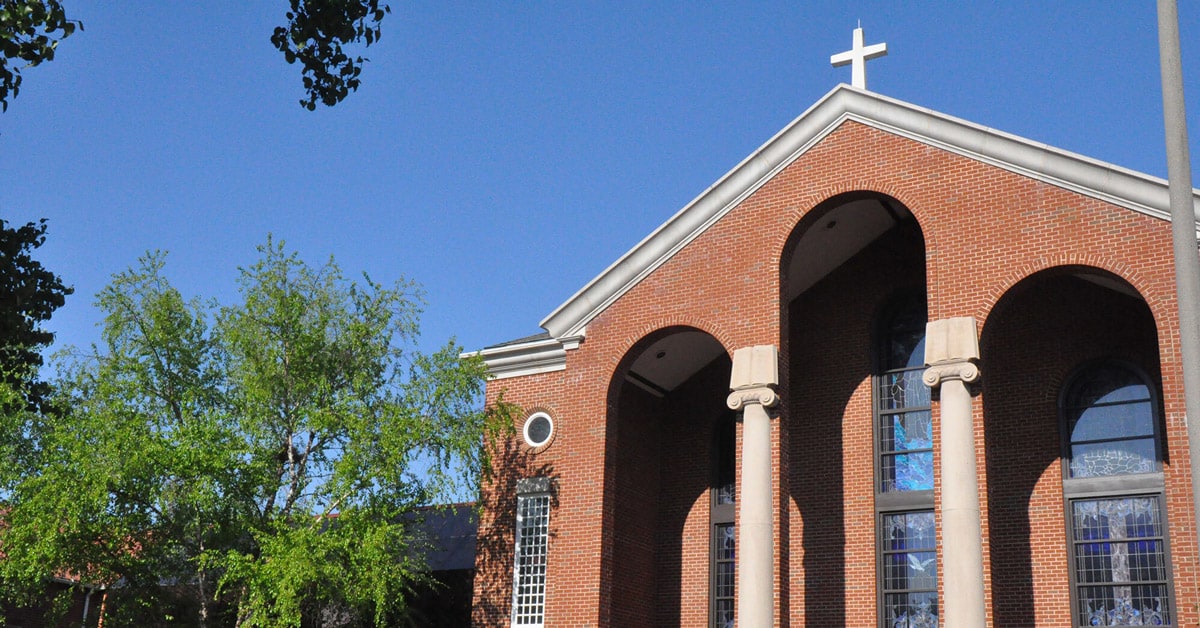 Historic Alfred Street Baptist Church building with white columns in Alexandria, Virginia