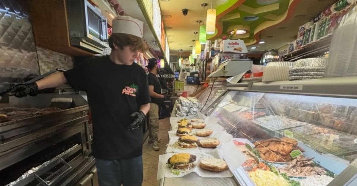 Young teen Dan smiling while handing out home-cooked meals to people on city street