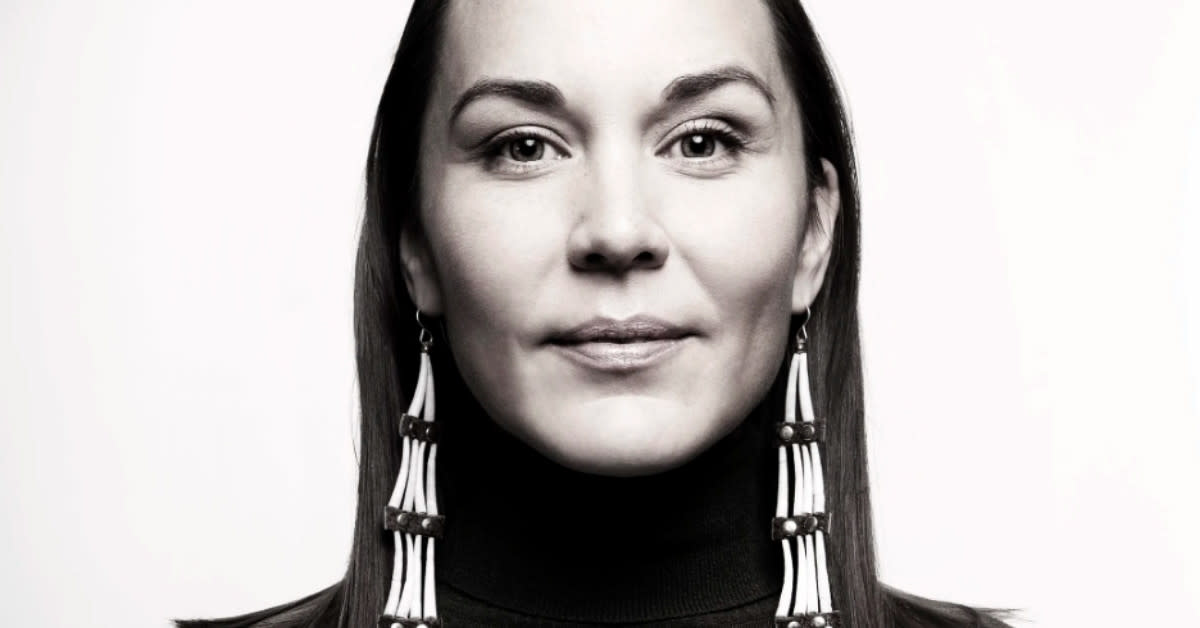 Indigenous woman in traditional Southern Buckskin dress photographed in artistic doll box display