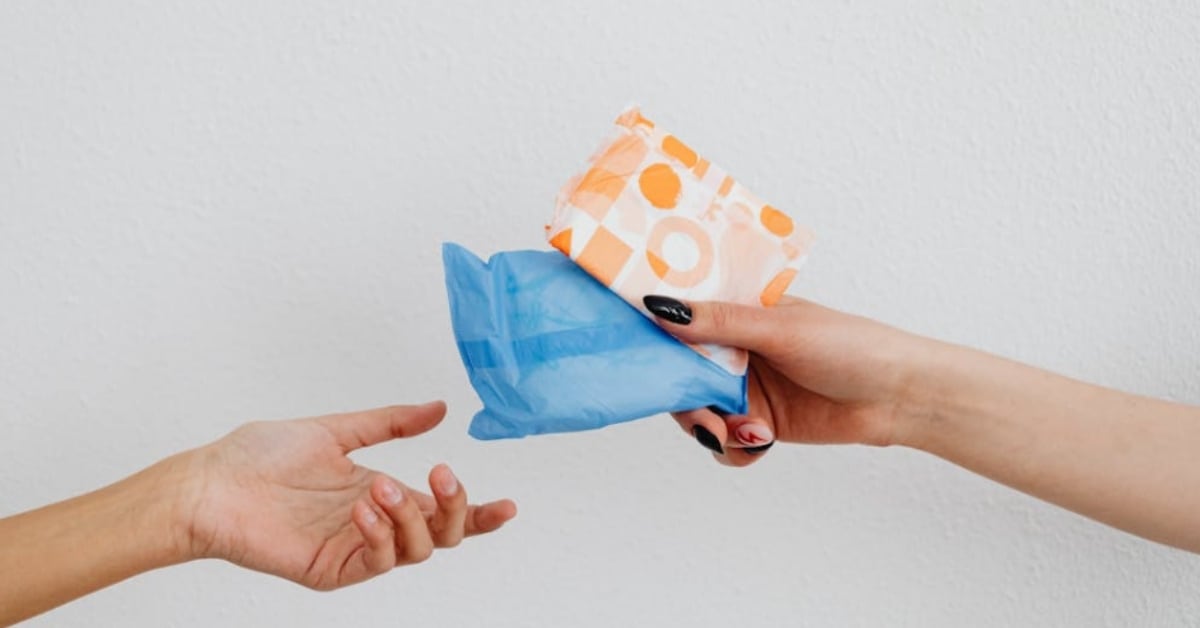 Young Pakistani woman lawyer holding legal documents in professional setting