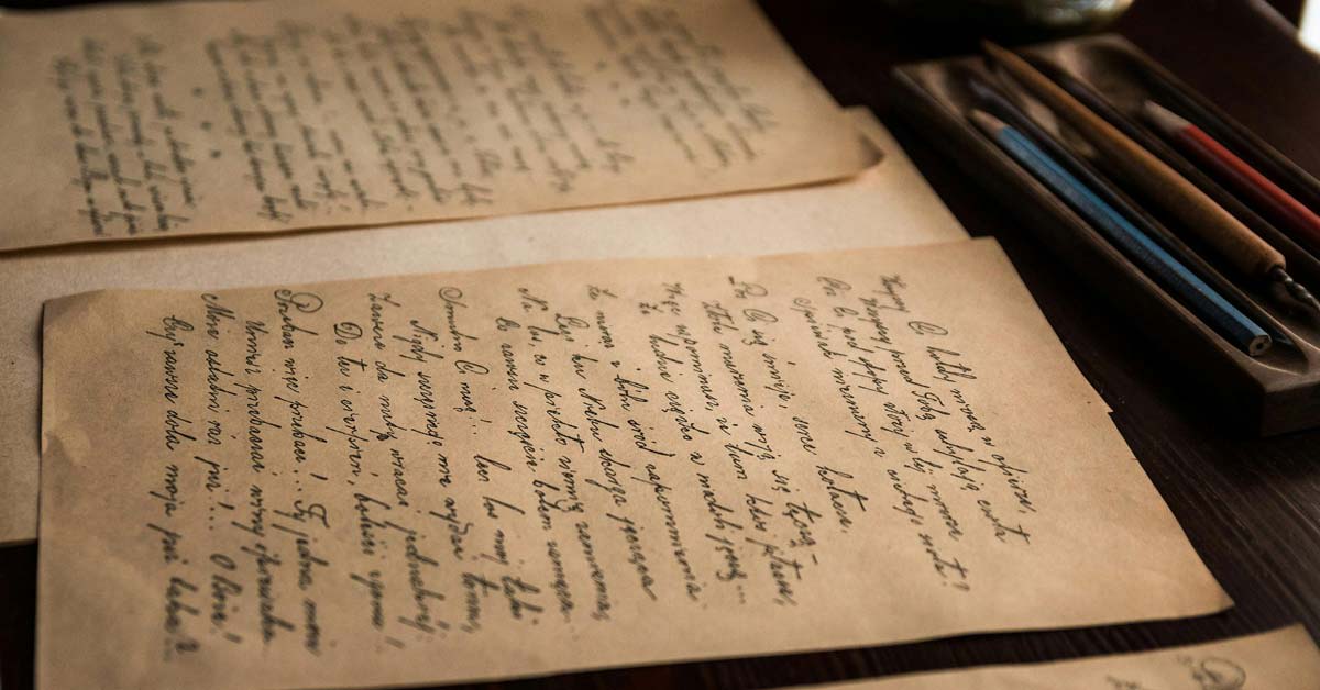 Close-up of vintage cursive handwriting in an old log book from university archives