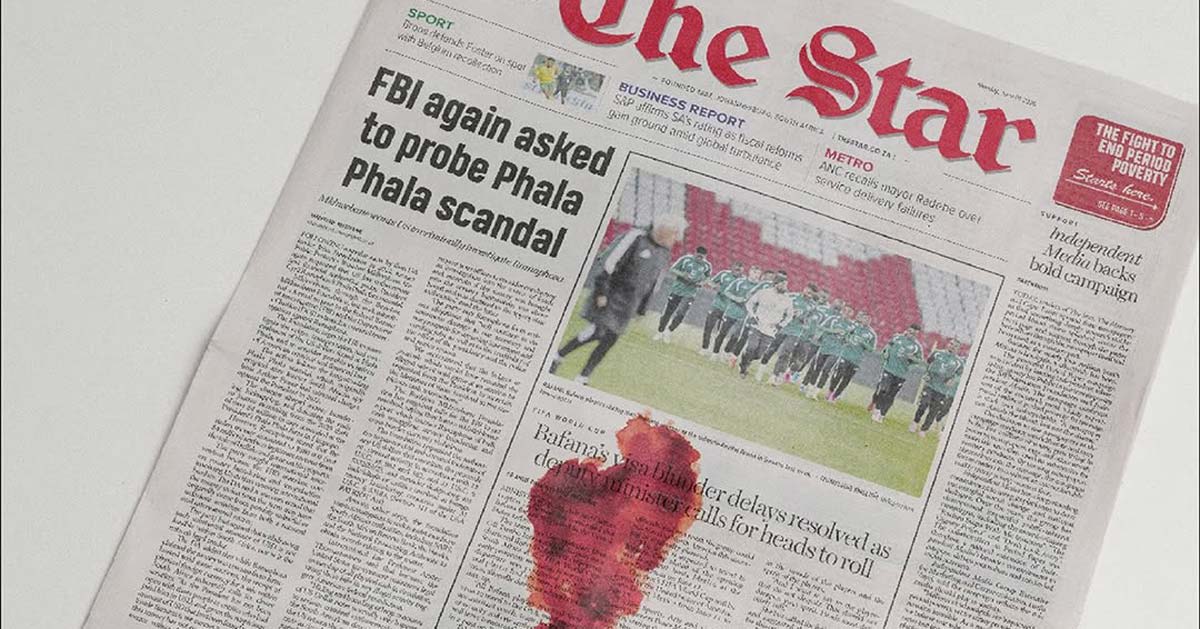 South African newspaper front page with red stain showing period poverty awareness campaign