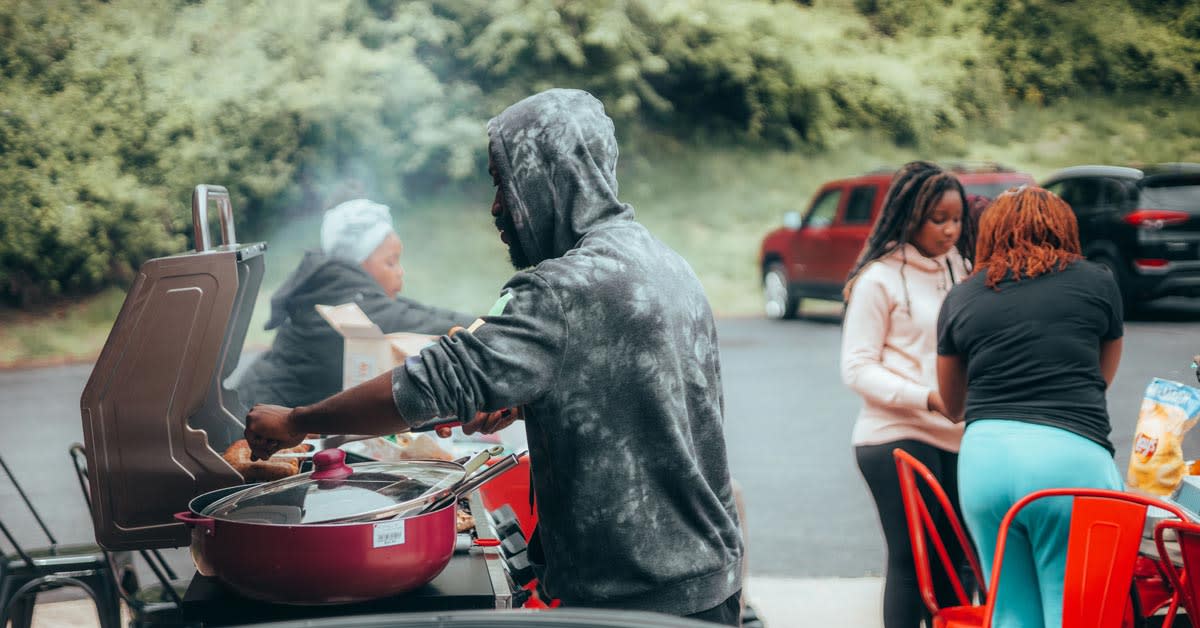 Smoked barbecue ribs and traditional side dishes on table at Juneteenth celebration