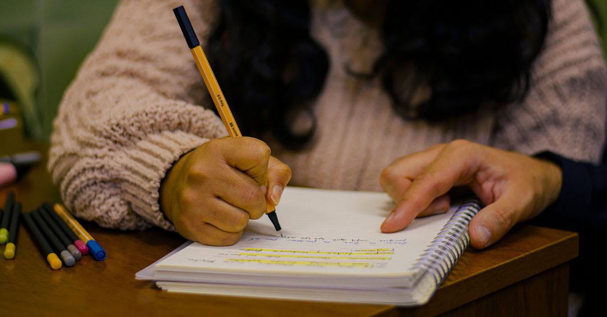 Diverse group of teenage poets writing and sharing their hopeful poetry together
