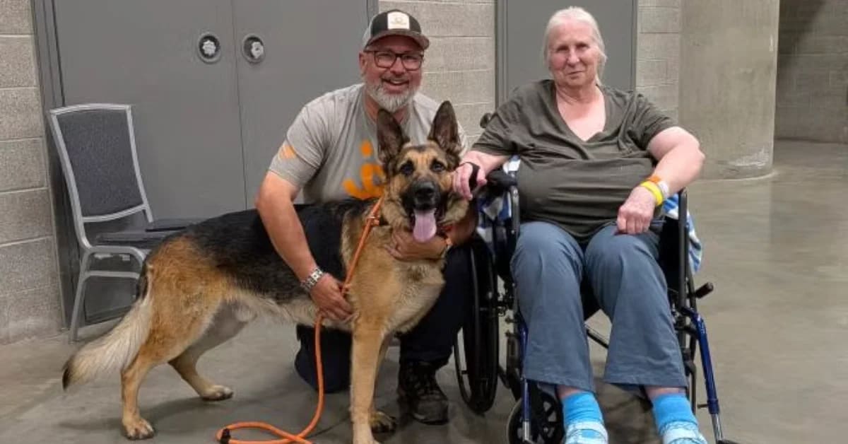 Donna Carberry smiling with her German Shepherd Shadow who saved her from wildfire