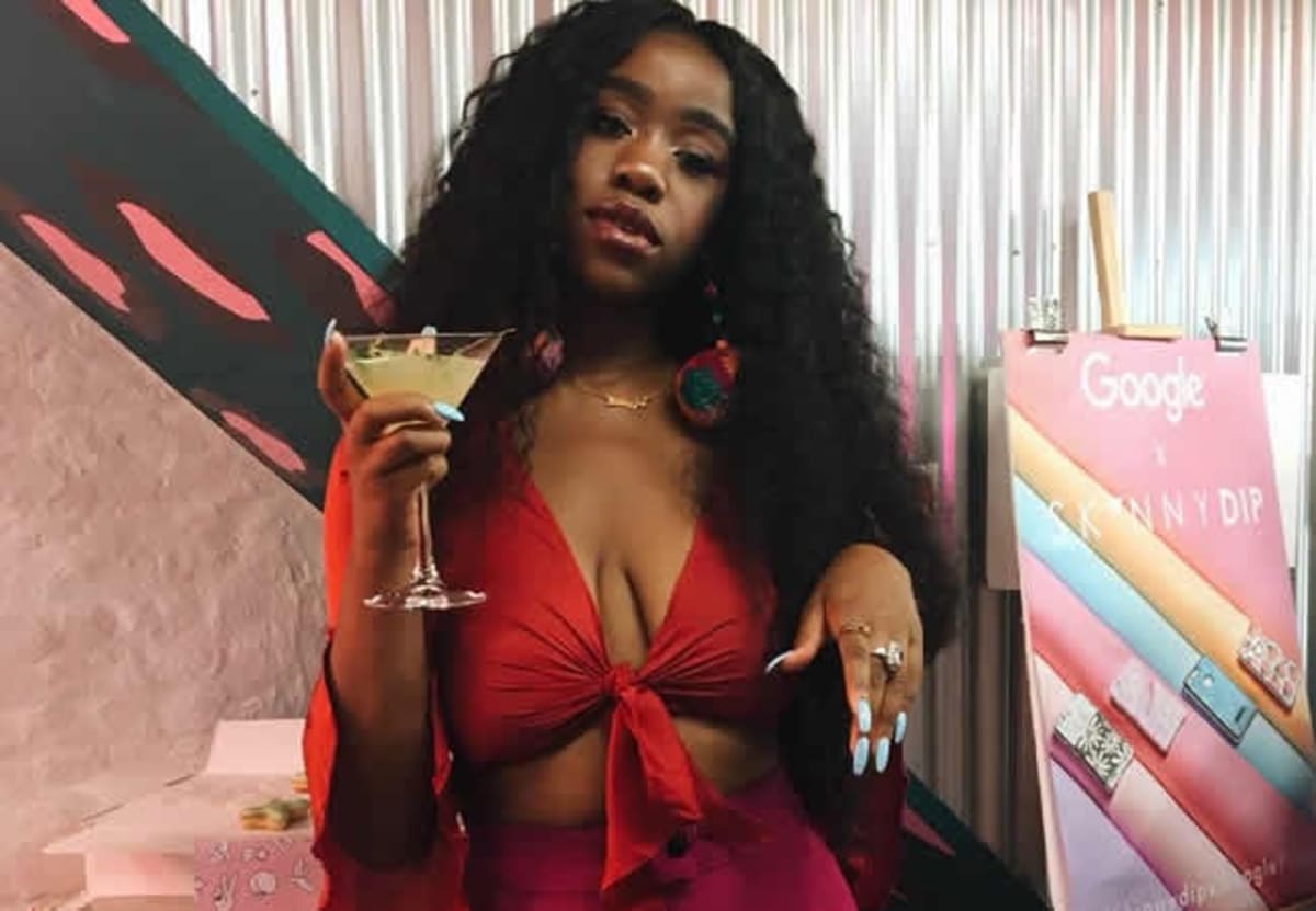 Chidera Eggerue, known as The Slumflower, smiling in casual portrait