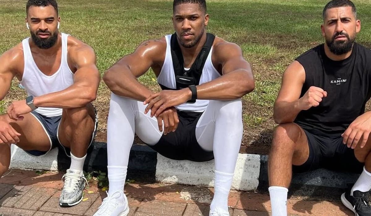 Heavyweight boxer Anthony Joshua training in gym, focused and determined during workout session