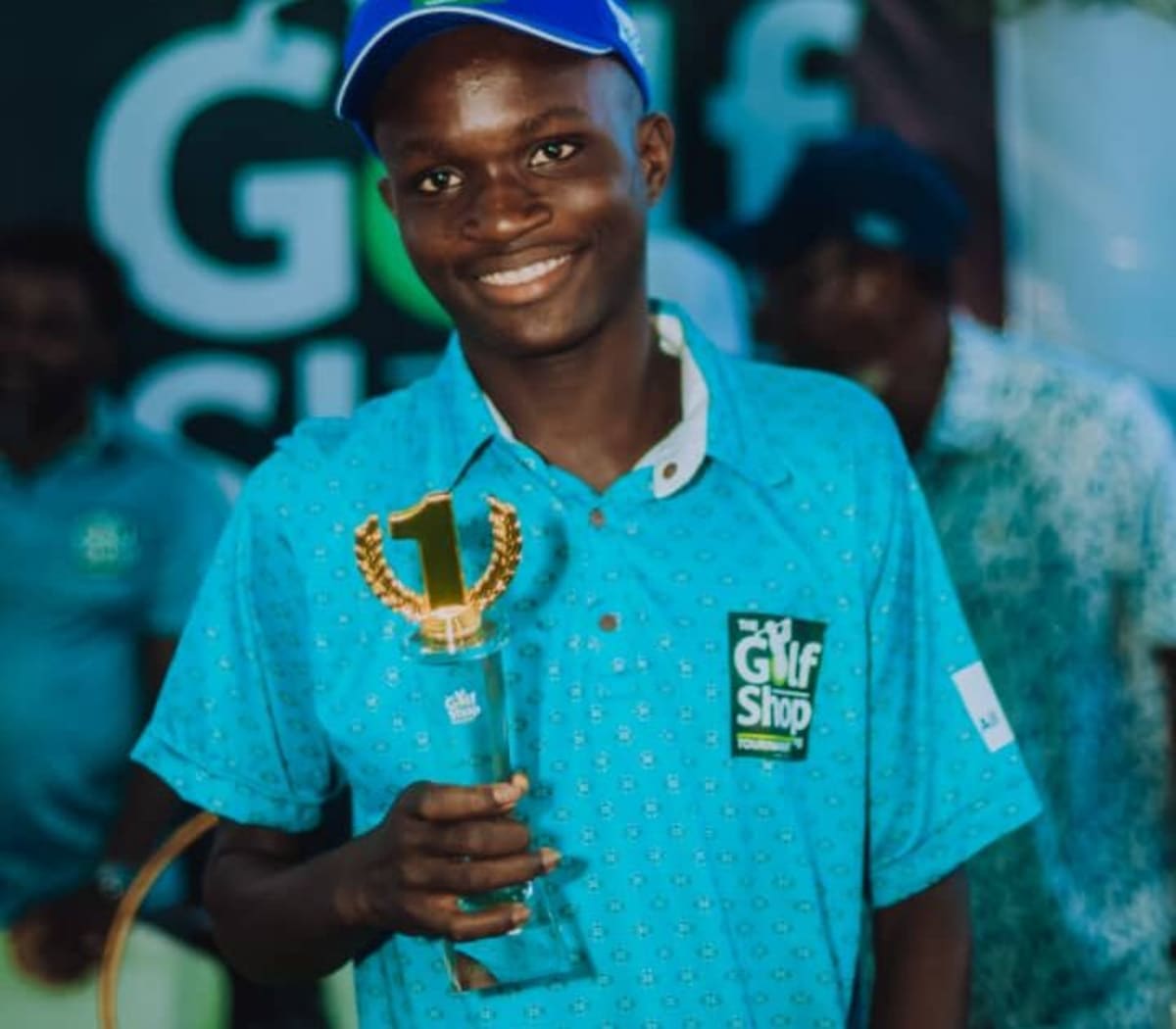 Young golfer Malik Adams celebrating victory at Elephant Cement Golf Club tournament