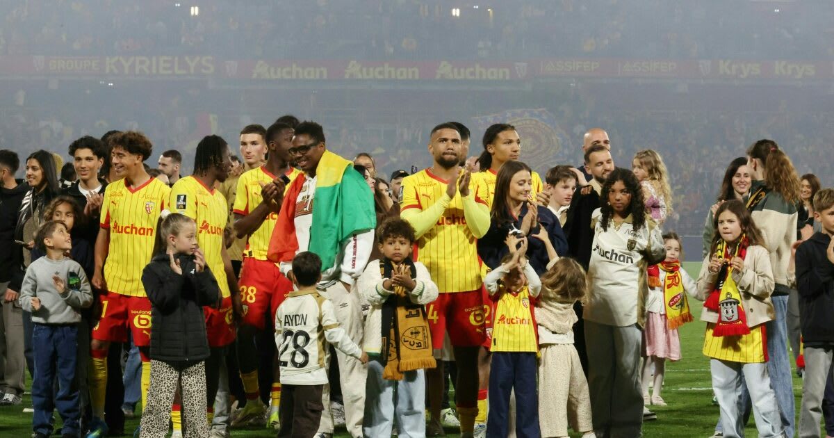 Lens players celebrate with fans at Stade Bollaert after qualifying for Champions League
