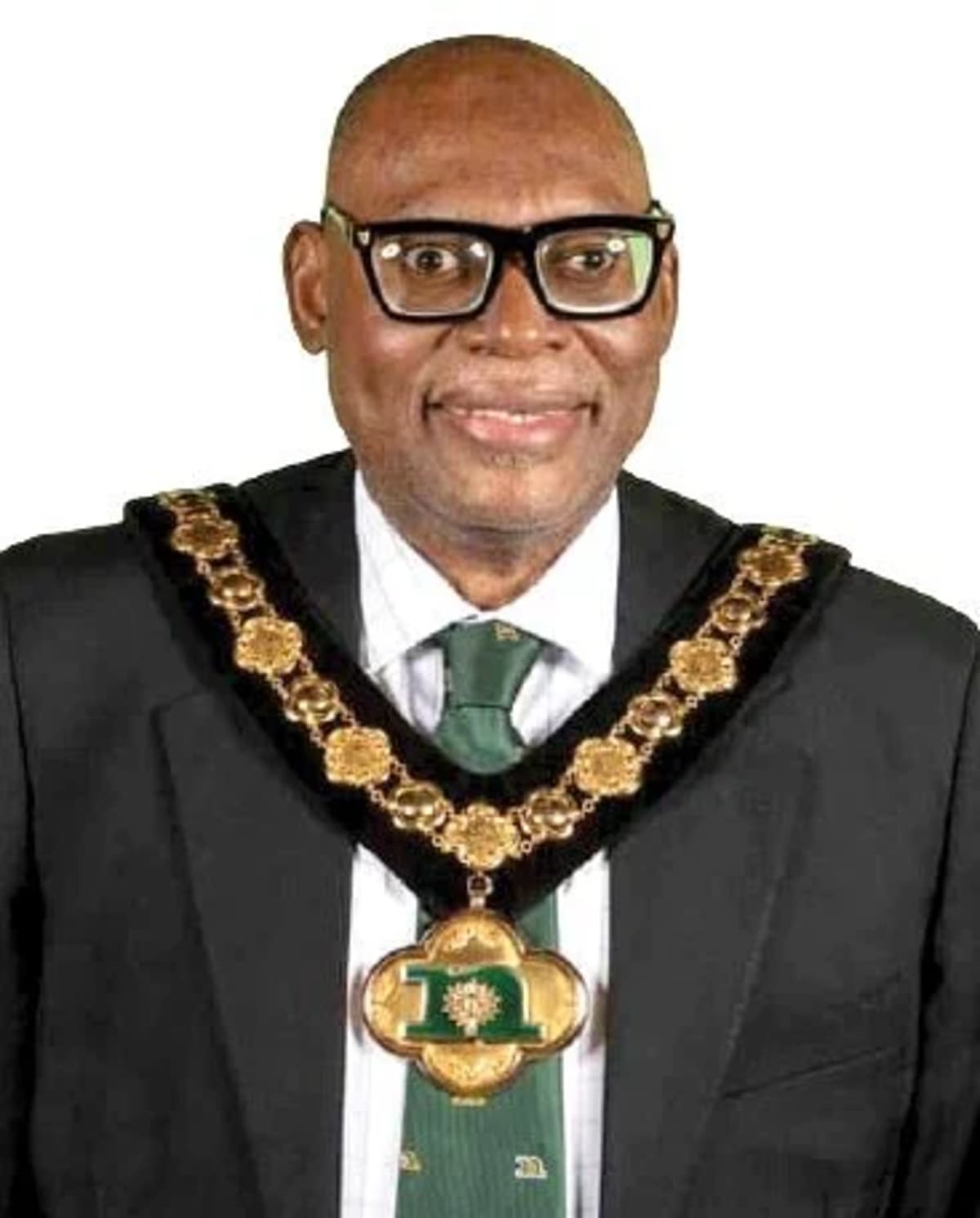 Christopher Adegoke, Nigerian-born chairman of Nottinghamshire County Council, smiling in formal attire