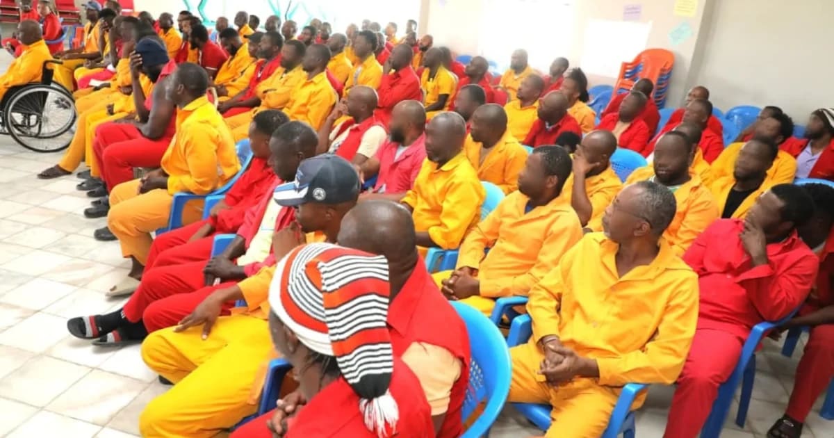 Nigerian inmates celebrating with raised arms at AbaSamuel Prison in Ethiopia after transfer agreement announcement