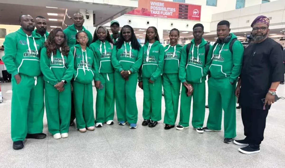 Nigerian chess players sitting at tournament boards during World Chess Olympiad competition in Uzbekistan