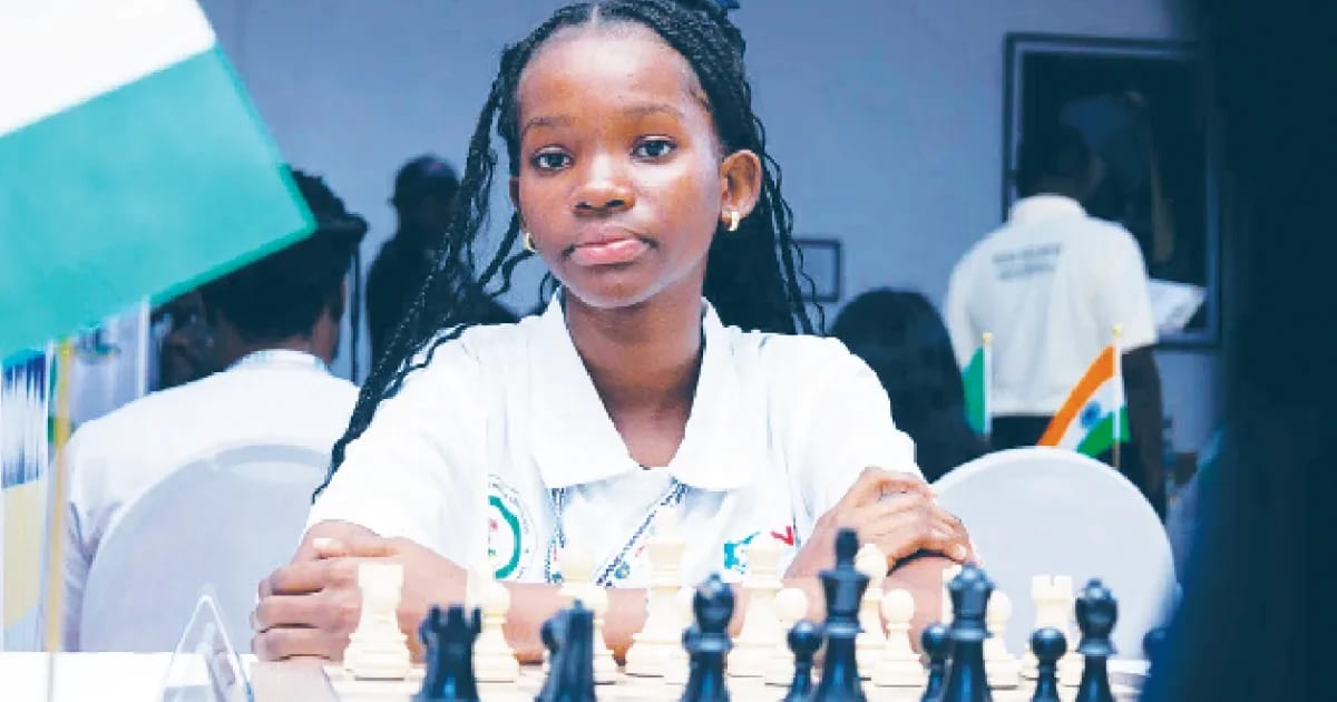 Nigerian teen chess player Sandra Omoruyi smiling after winning World Rapid Amateur Championship