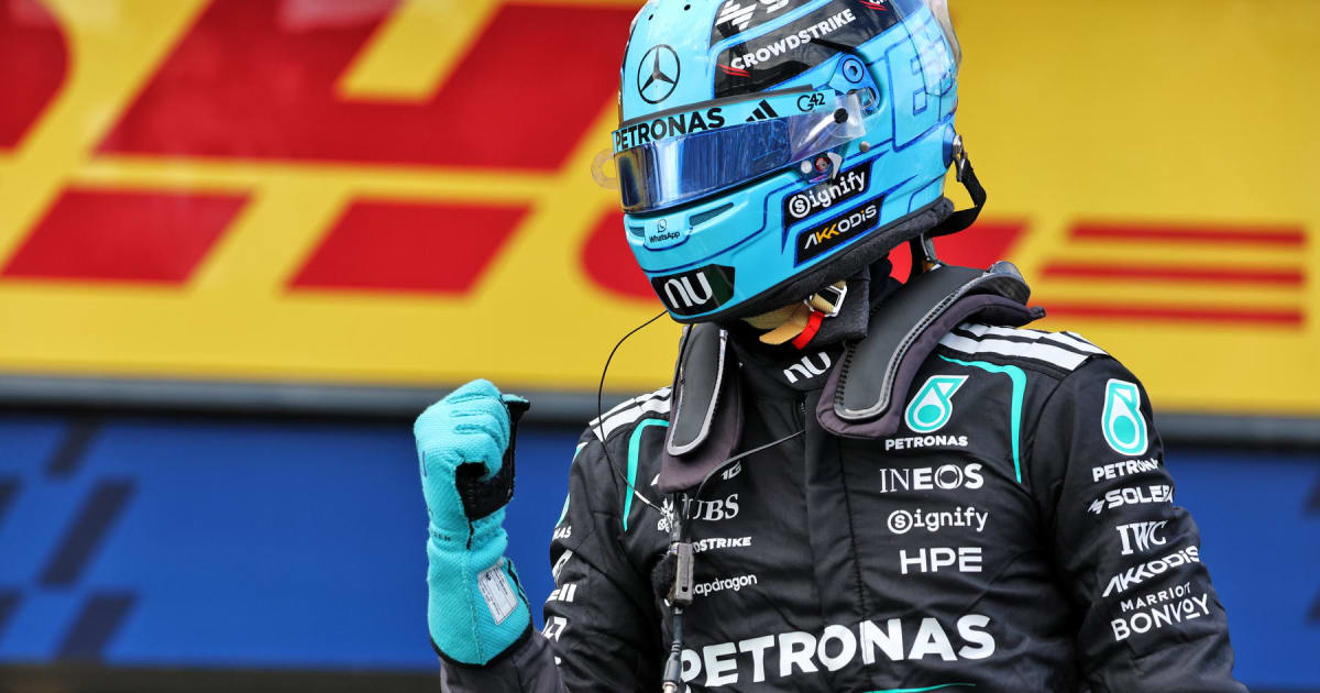 George Russell celebrates on podium after winning Australian Grand Prix for Mercedes team