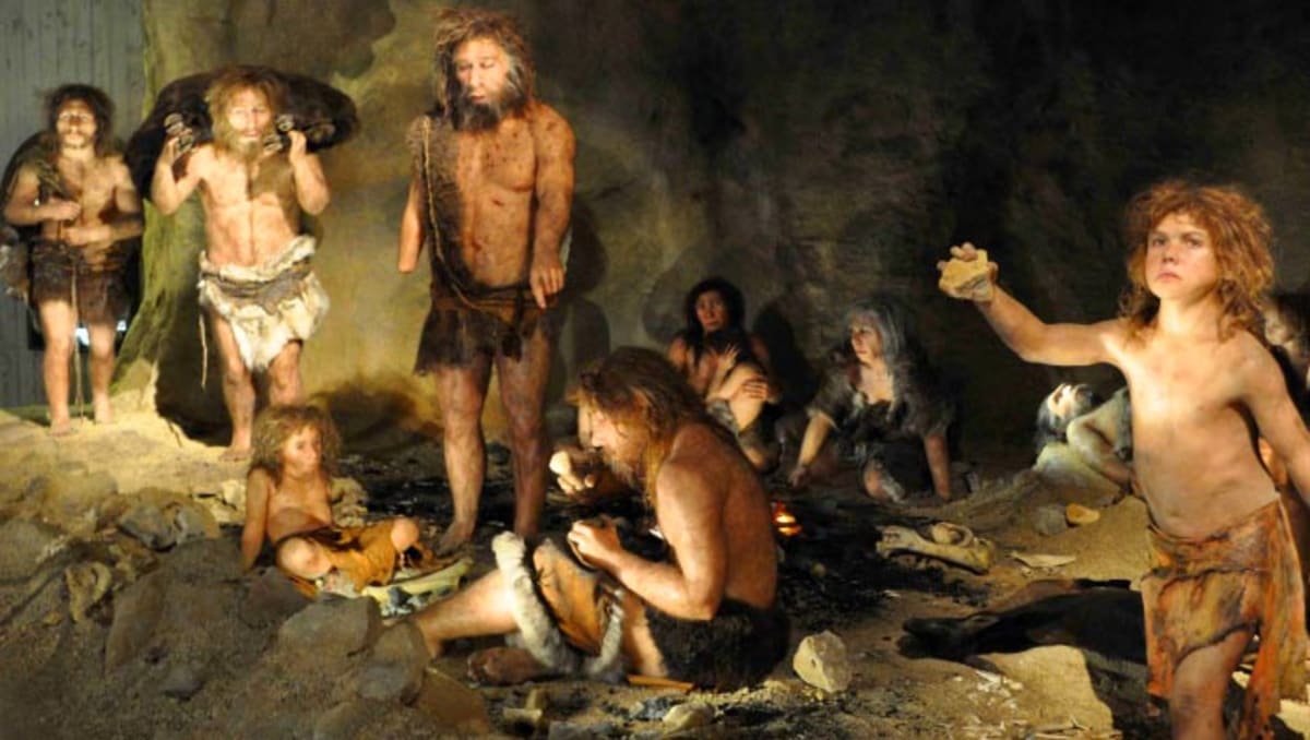 Artist's rendering of Neanderthal family group living together in ancient Polish cave