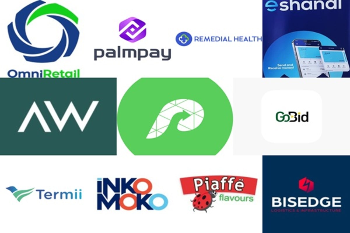 ** Nigerian entrepreneurs working on laptops in modern tech startup office space