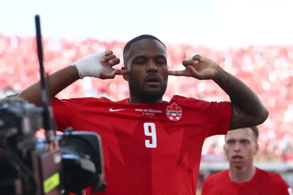 ** Canadian soccer players celebrating historic first World Cup victory at BC Place stadium in Vancouver