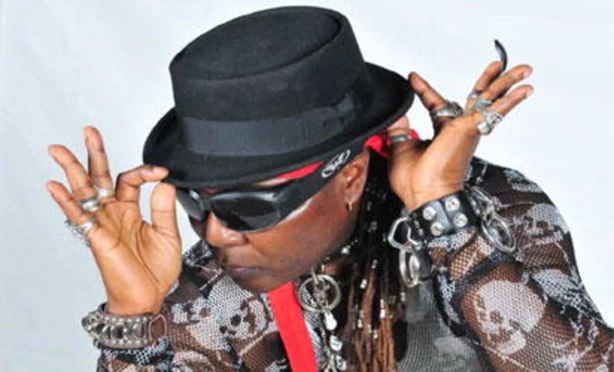 ** Nigerian entertainer Charly Boy smiling confidently, advocate for men's health and cancer awareness