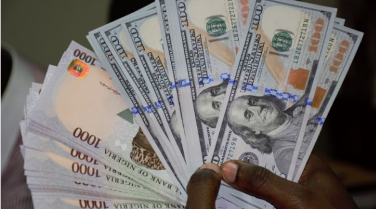 Nigerian naira banknotes and US dollar bills side by side representing stable currency exchange