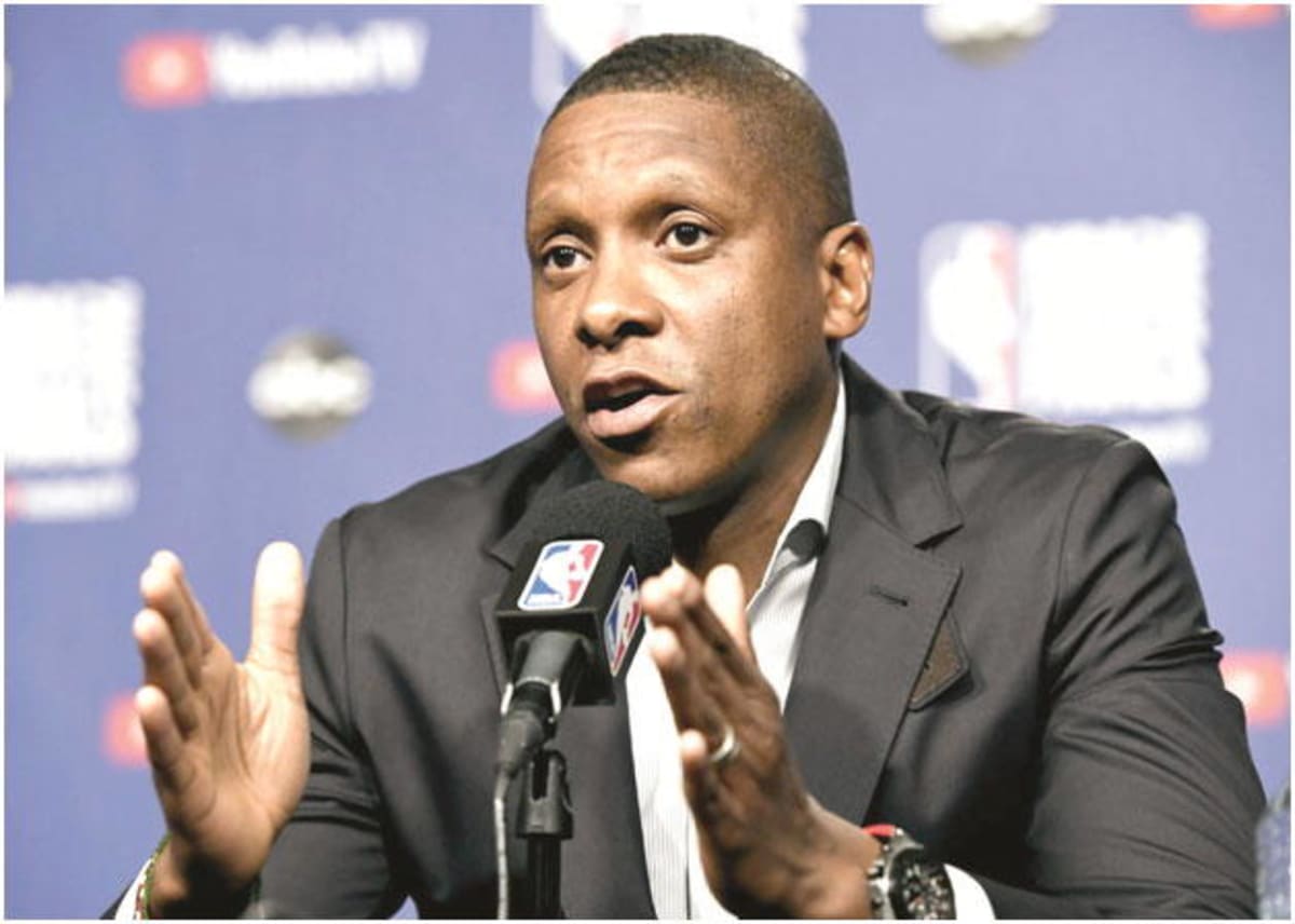 Masai Ujiri standing on basketball court speaking to crowd at King's College Lagos ceremony