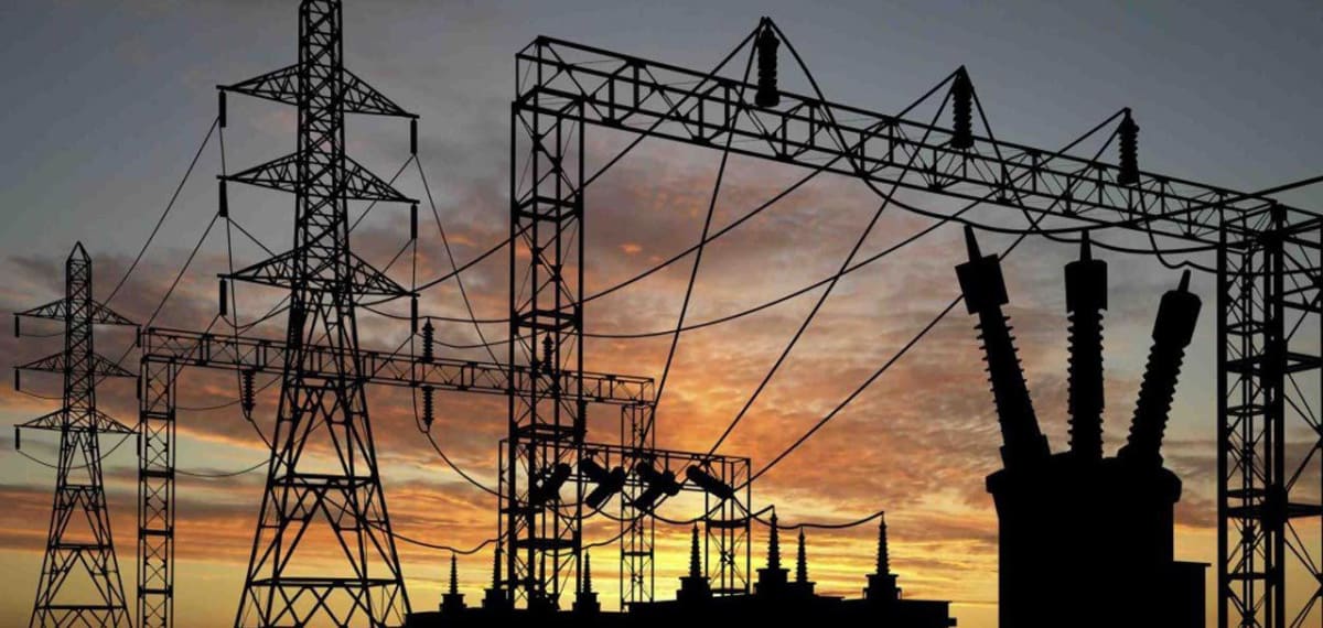 Electricity transmission towers and power lines carrying electricity across Nigerian landscape