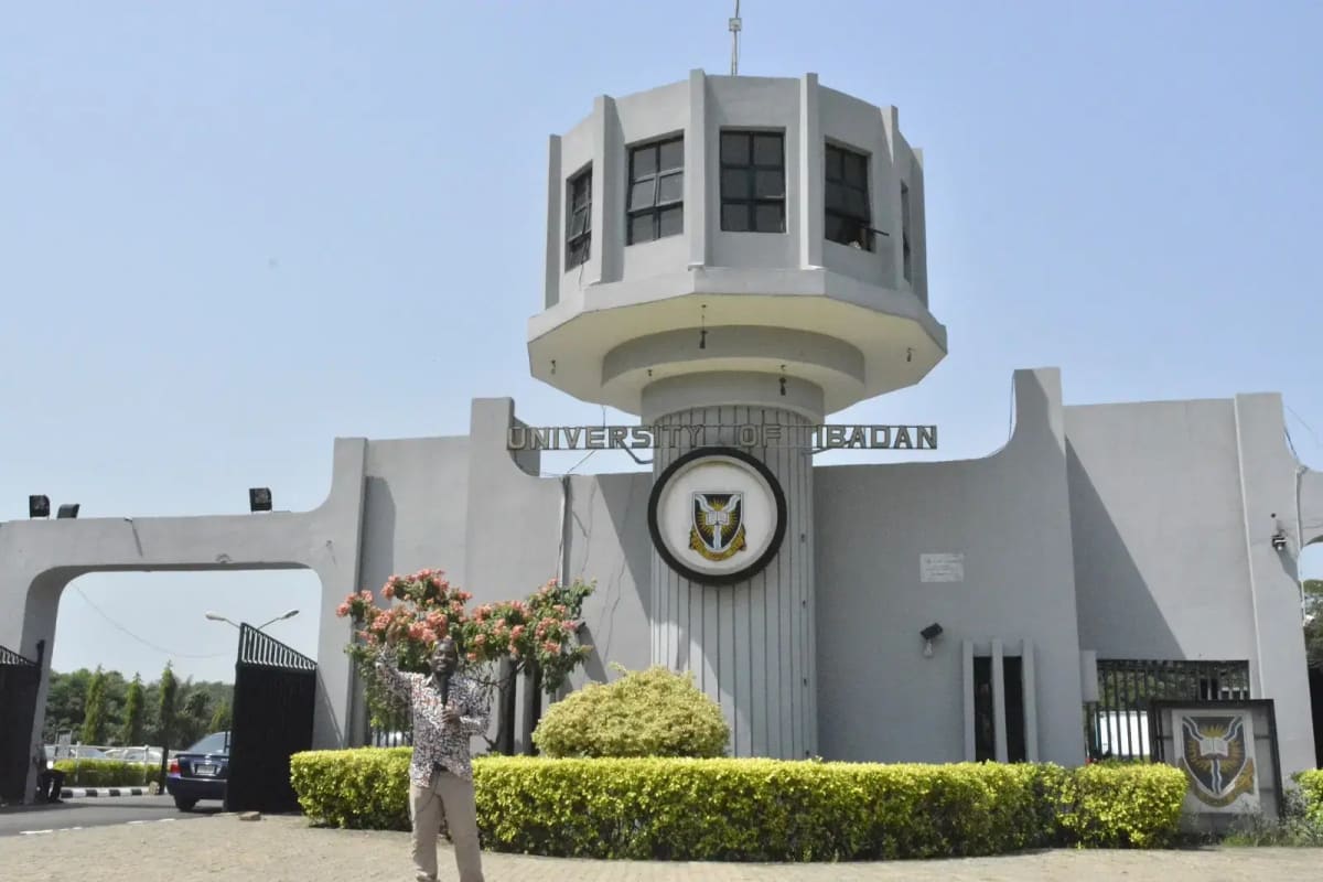 University of Ibadan campus building entrance with students walking on pathway