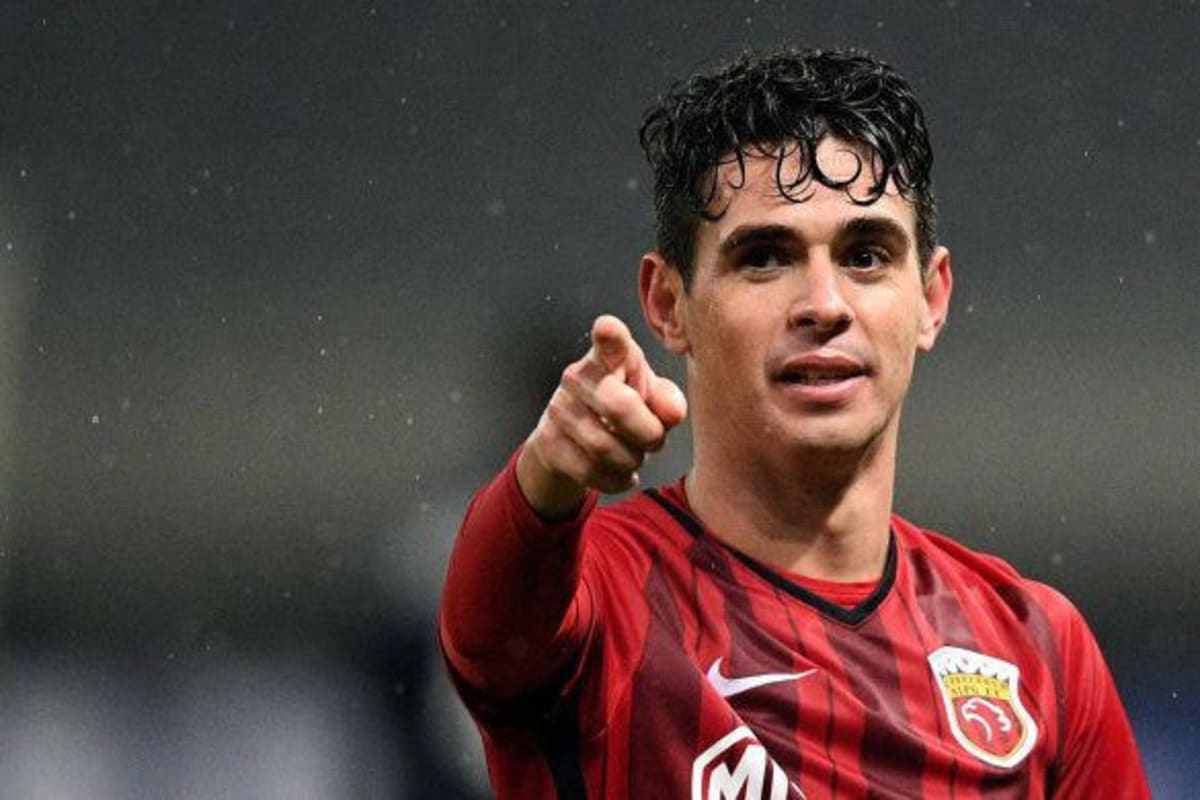 Former Chelsea midfielder Oscar smiling with his family after recovering from cardiac arrest