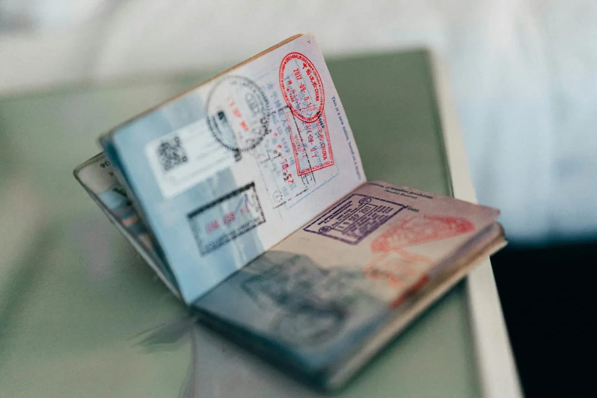 Nigerian passport with international visa stamps symbolizing new global mobility opportunities for professionals