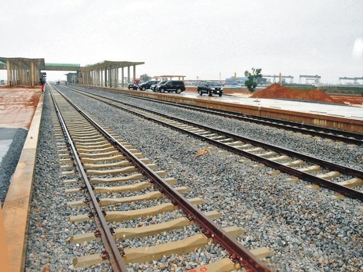 Train traveling on railway tracks in Nigeria showing modern passenger rail service