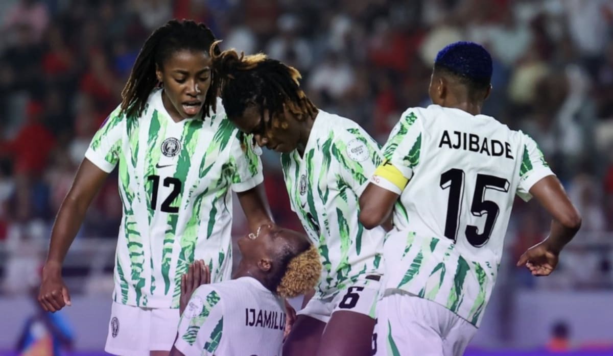 Nigeria's Super Falcons women's soccer team celebrating on the field together