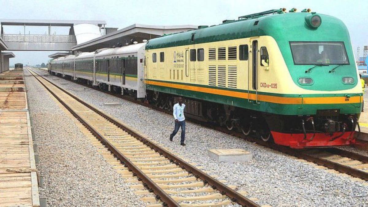 Nigerian passenger train traveling on railway tracks carrying holiday travelers across the country
