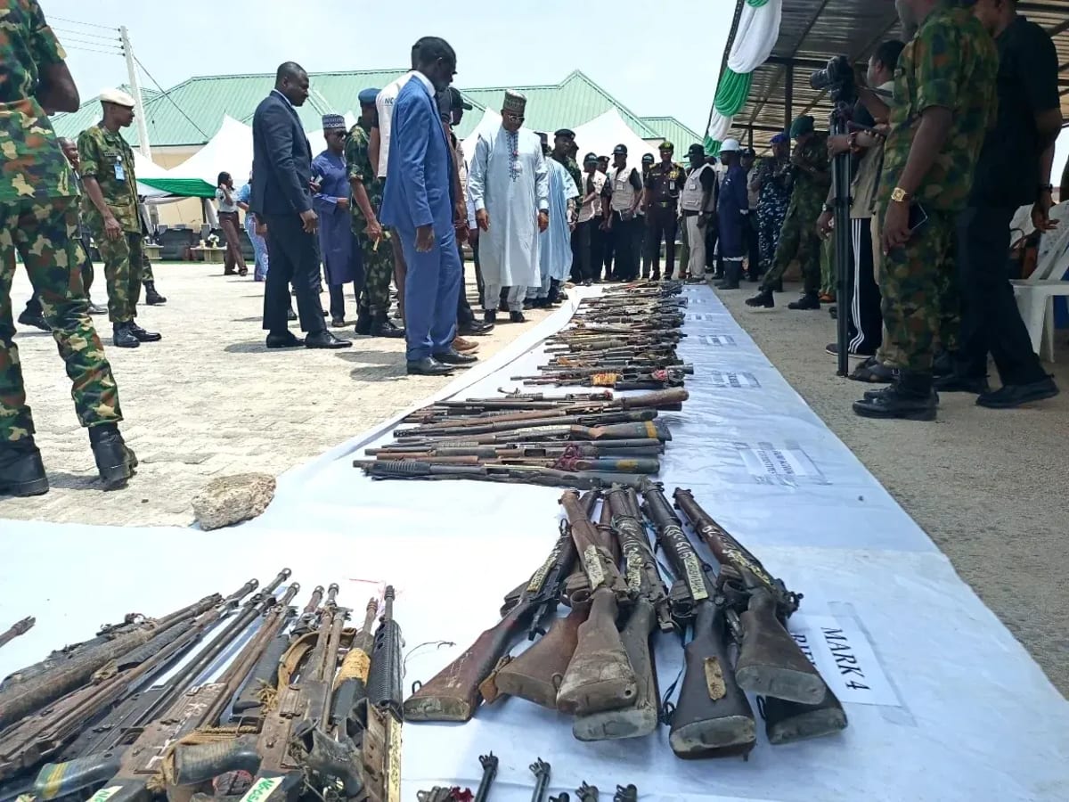Nigerian security officials overseeing public destruction of thousands of confiscated illegal firearms in Abuja
