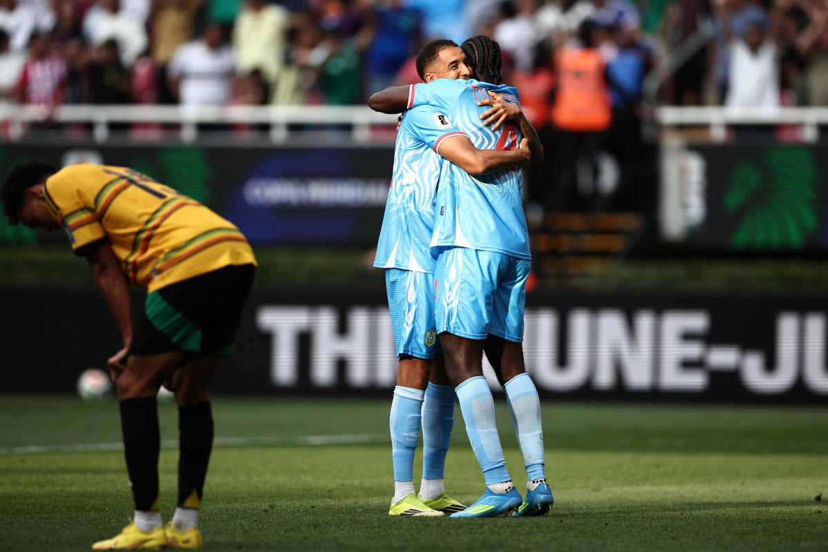 DR Congo players Axel Tuanzebe and Charles Pickel celebrating World Cup qualification victory