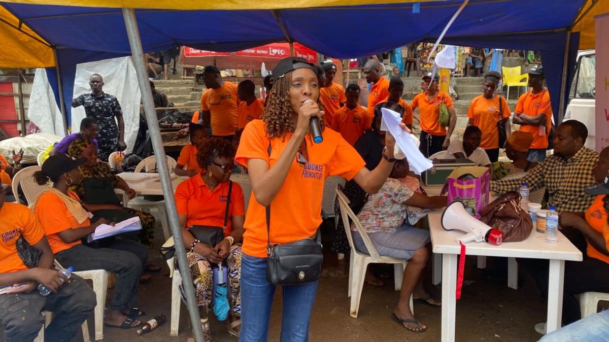 Medical volunteers providing health screenings to women market traders in Lagos Nigeria