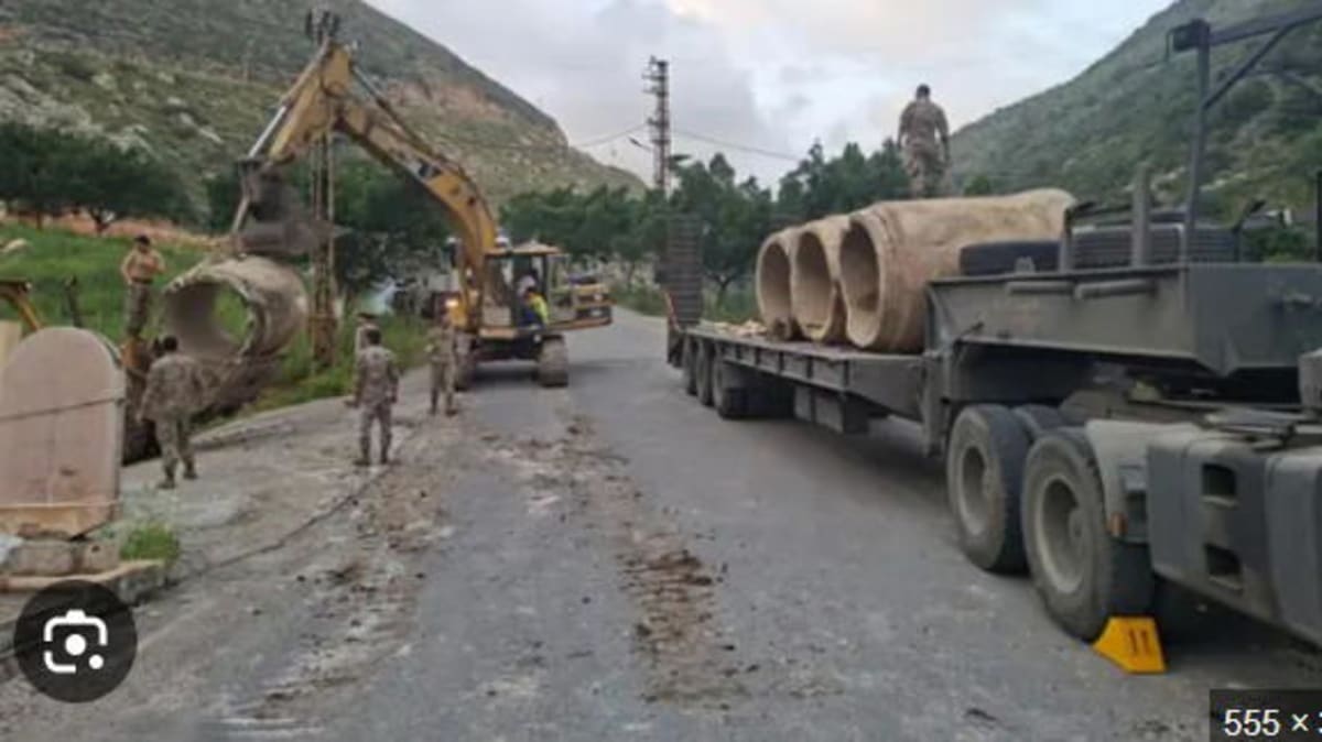 Lebanese military engineers working to repair bridge damaged during recent conflict in southern Lebanon