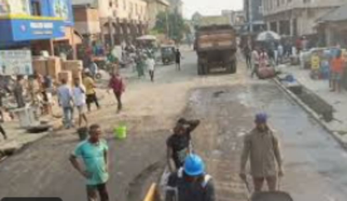 Busy motor park with vehicles and people on York Street Aba Nigeria