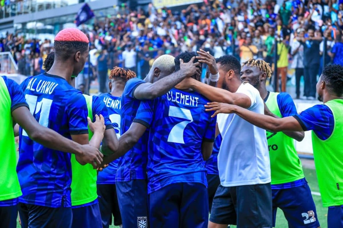 Sporting Lagos football players celebrating their promotion victory on the pitch in Nigeria