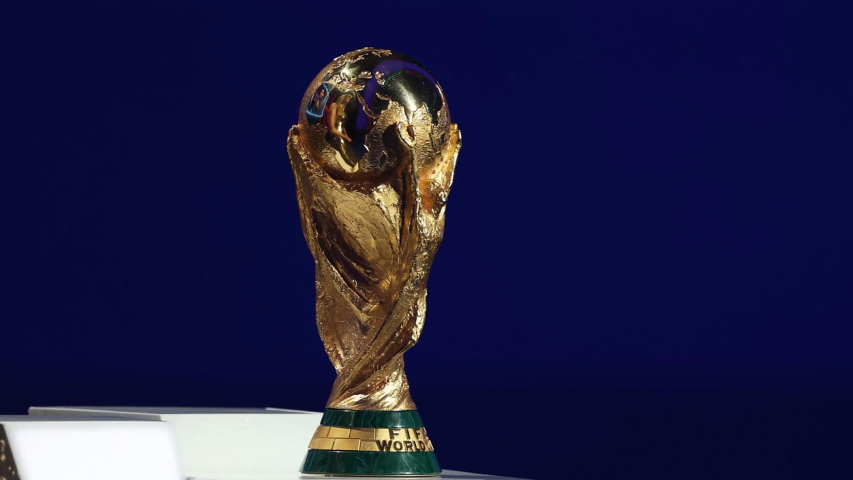 ** FIFA World Cup trophy on display representing dreams achieved by players who nearly quit
