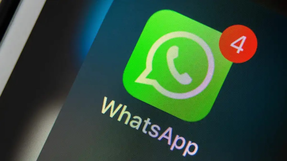 Person holding smartphone with WhatsApp messaging interface showing username feature for private communication